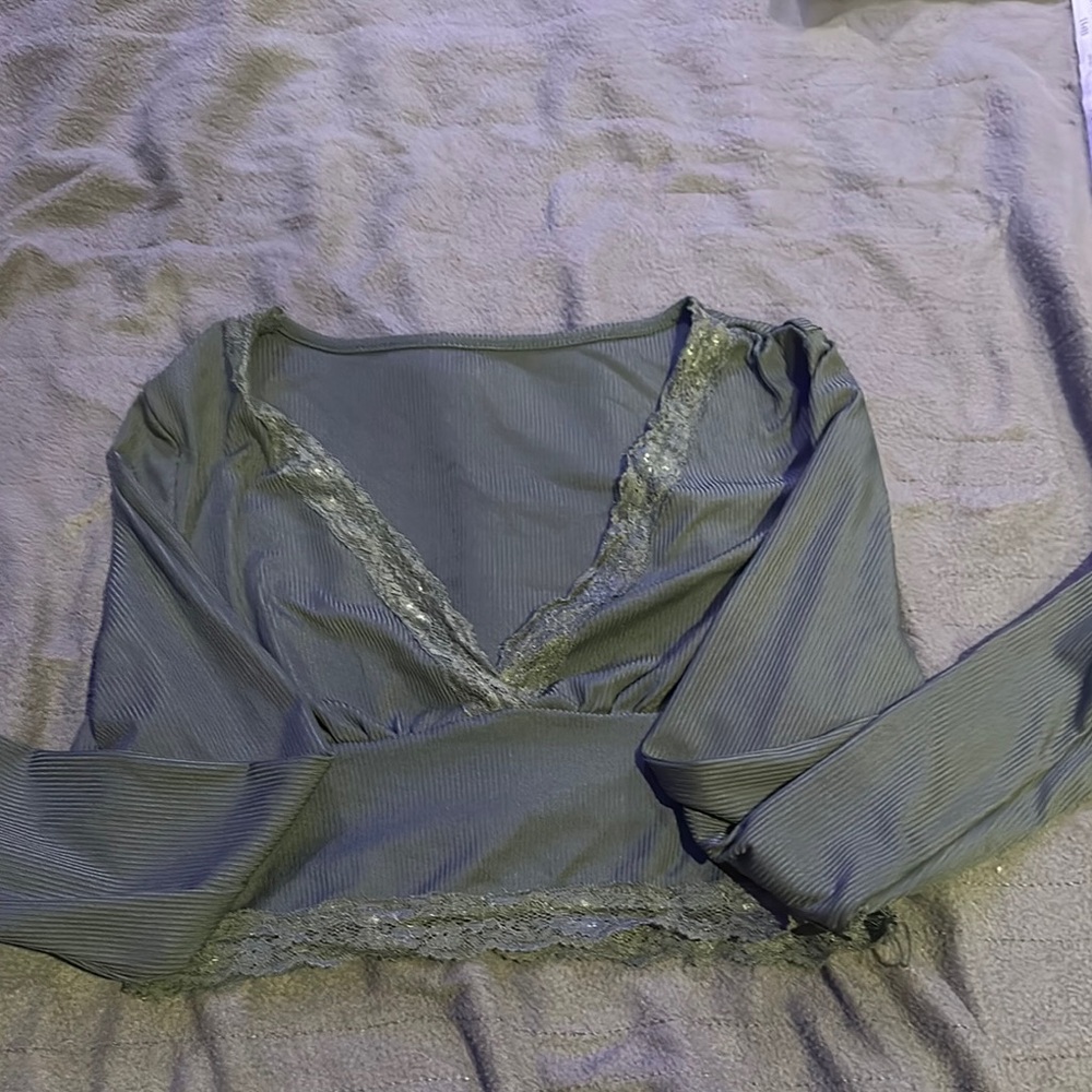 Green, cropped, lace lined shirt.